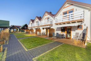 Drewniane Wakacyjne Domki w Urokliwej Okolicy by Noclegi Renters in Grzybowo